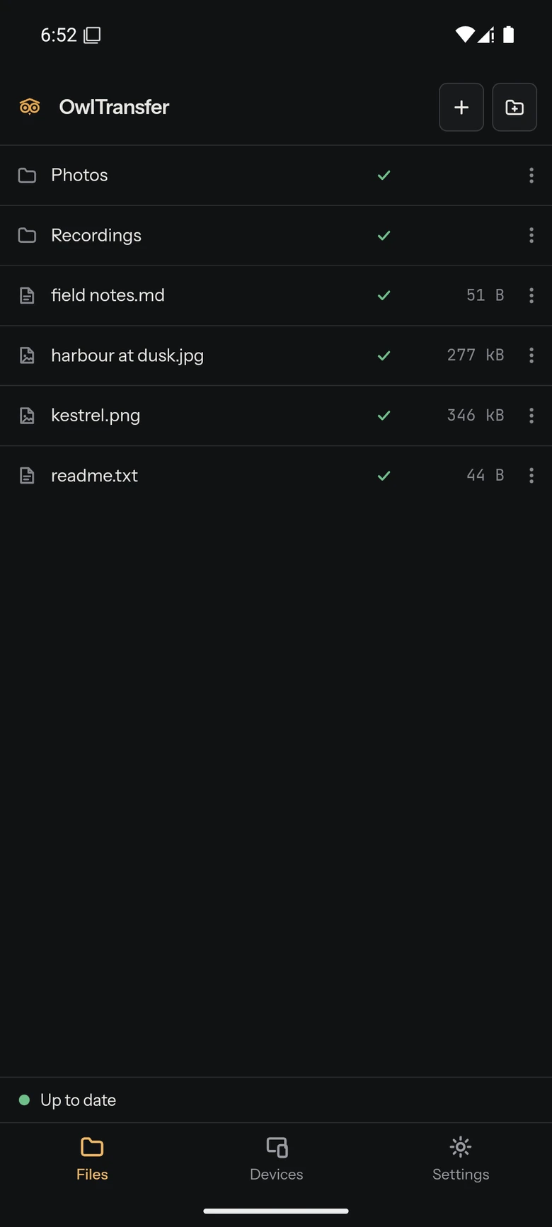 The same folder on a phone: a header with the owl mark and the OwlTransfer wordmark beside buttons for adding files and making a folder, a file list with a green sync badge and a size beside every name, a status strip along the bottom reading Up to date, and tabs for Files, Devices and Settings under it.